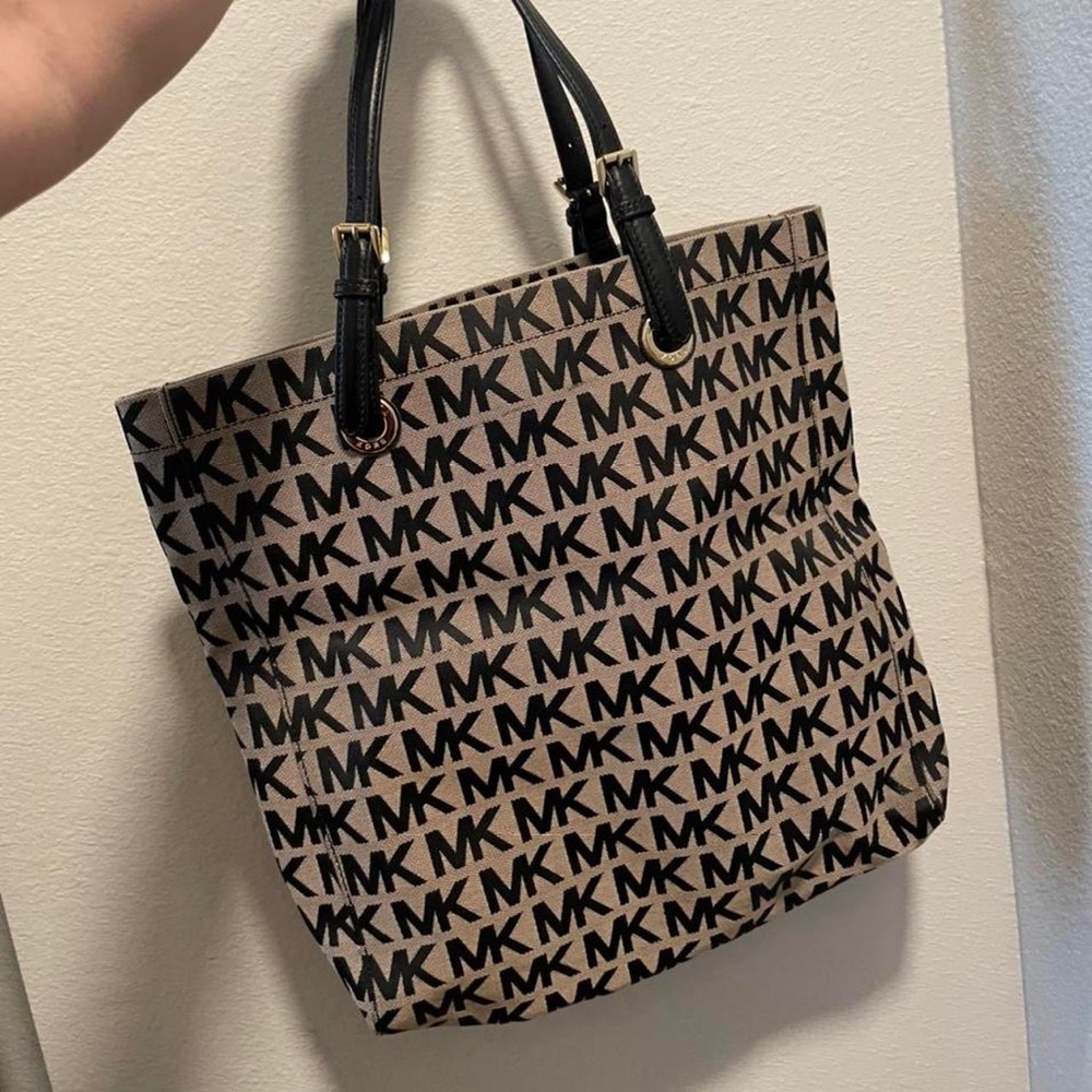 Michael Kore tote in beige and black with leather accents and gold hardware